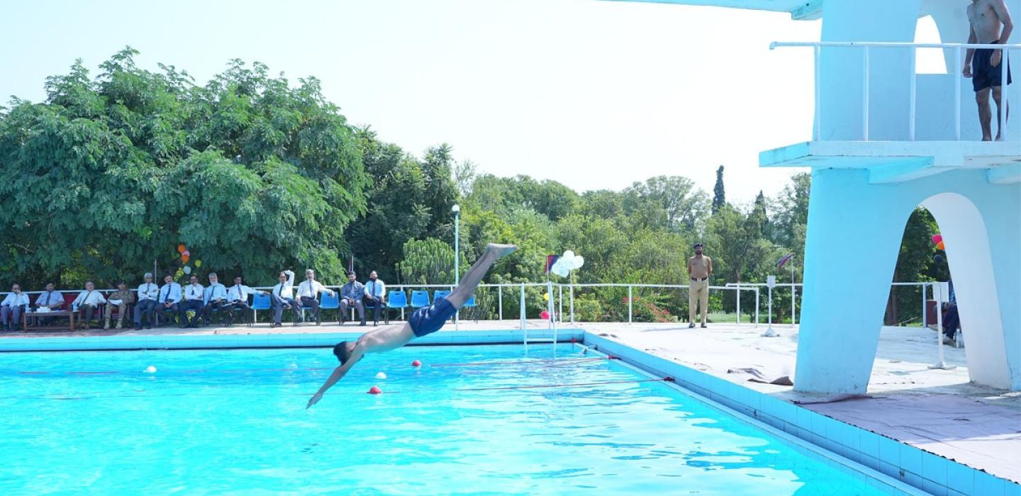 Cadet jumping into the pool